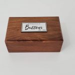 Wooden urn with plaque